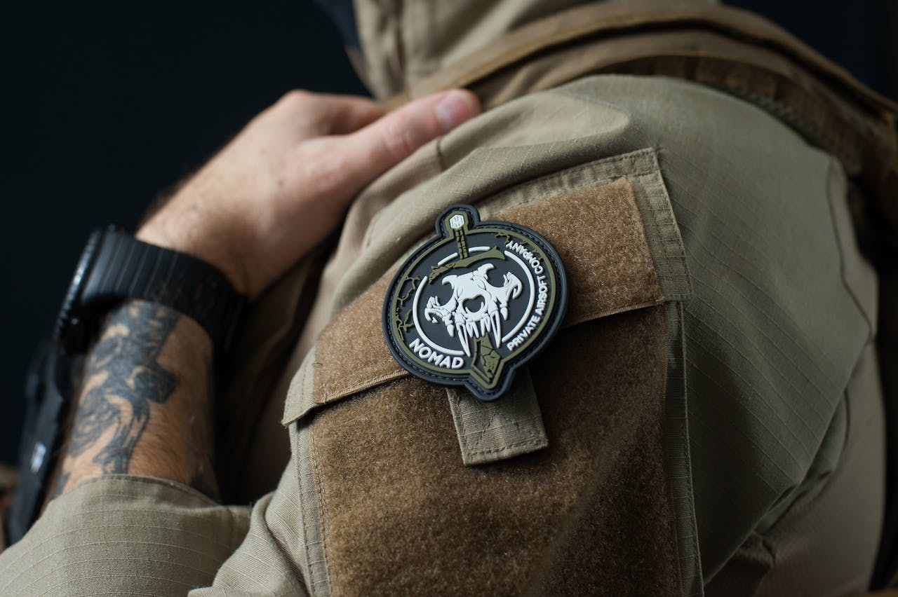 about-02 Detailed close-up of a tactical patch on a military uniform, showcasing design details and fabric texture.